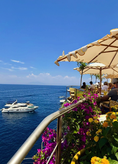 A wooden gozzo boat tour along the turquoise water of Capri